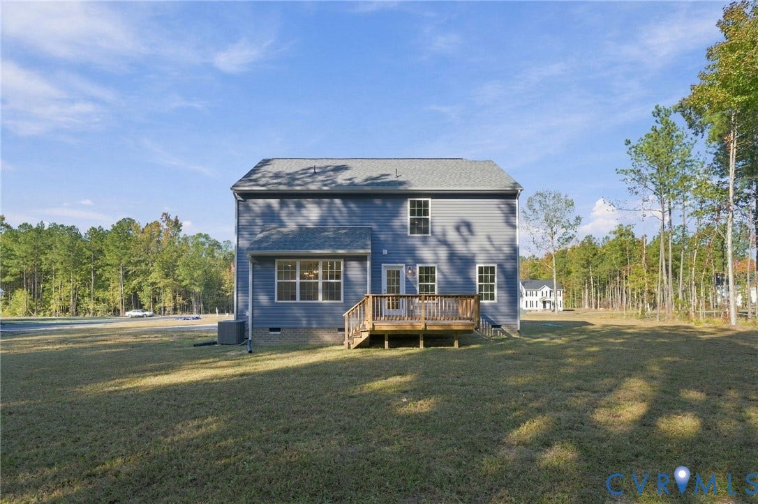 8209 Grantham Woods Way, Grantham Woods, Henrico, VA 23231 Rear exterior featuring gray vinyl siding, a wooden deck, multiple grid-pattern windows, a shingled roof, and a surrounding lawn with mature trees