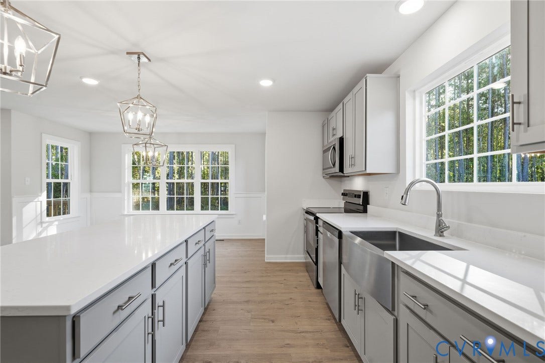 8209 Grantham Woods Way, Grantham Woods, Henrico, VA 23231 Kitchen featuring shaker-style cabinetry, quartz countertops, a stainless steel farmhouse sink, geometric pendant lighting, and wood-finish flooring
