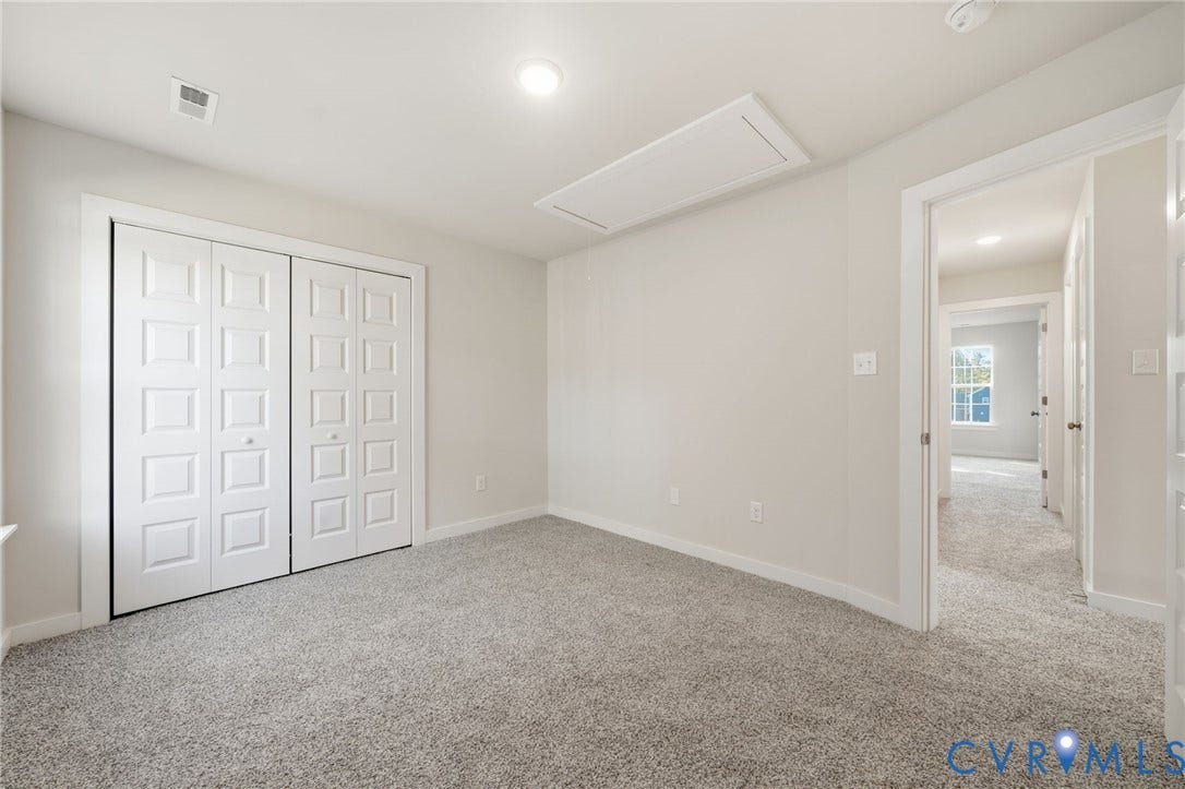 8209 Grantham Woods Way, Grantham Woods, Henrico, VA 23231 Neutral interior featuring plush wall-to-wall carpeting, recessed ceiling lighting, and a double-door closet with square-paneled detailing