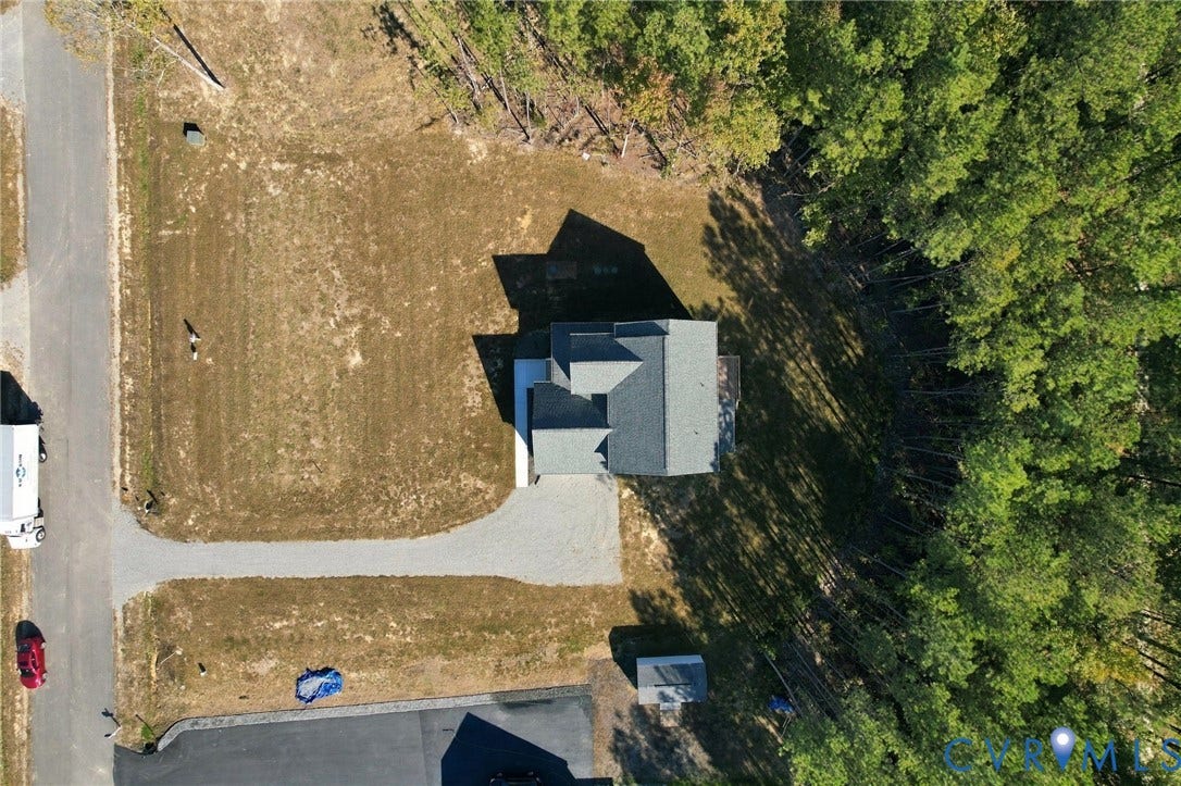 8209 Grantham Woods Way, Grantham Woods, Henrico, VA 23231 Aerial perspective of a detached residence featuring a gravel driveway, asphalt shingle roof, and expansive wooded lot perimeter