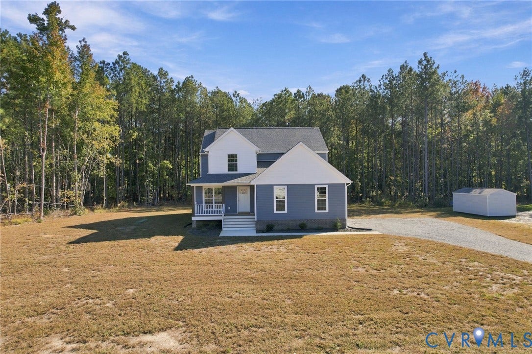 8209 Grantham Woods Way, Grantham Woods, Henrico, VA 23231 Two-story residence featuring a multi-gable roofline, front porch, gravel driveway, and detached storage structure