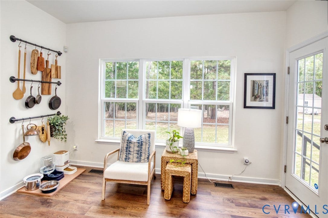 13501 Cooks Mill Court, Cooks Mill, Lanexa, VA 23089 Wall-mounted industrial-style matte black pipe racking, wood-finish flooring, triple-pane window configuration, and a half-light door with integrated window grid