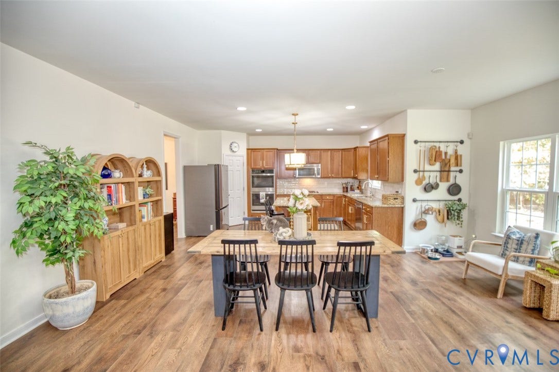 13501 Cooks Mill Court, Cooks Mill, Lanexa, VA 23089 Kitchen featuring wood-finish cabinetry, built-in double wall ovens, recessed lighting, and expansive wood-finish flooring