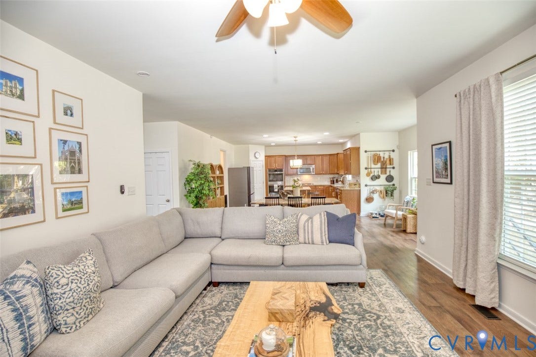 13501 Cooks Mill Court, Cooks Mill, Lanexa, VA 23089 Wood-finish flooring, ceiling fan with light fixture, and kitchen featuring wood cabinetry and built-in appliances