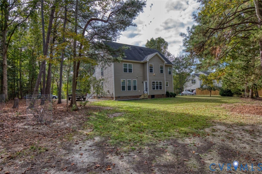 13501 Cooks Mill Court, Cooks Mill, Lanexa, VA 23089 Multi-story exterior featuring light-toned siding, a multi-gabled roofline, double-hung windows, and an expansive wooded lot