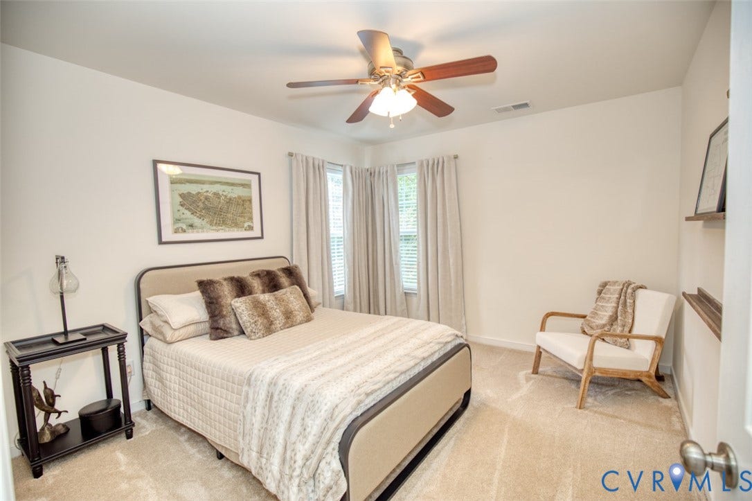 13501 Cooks Mill Court, Cooks Mill, Lanexa, VA 23089 Neutral-toned carpeting, ceiling fan with integrated light fixture, and dual-window wall