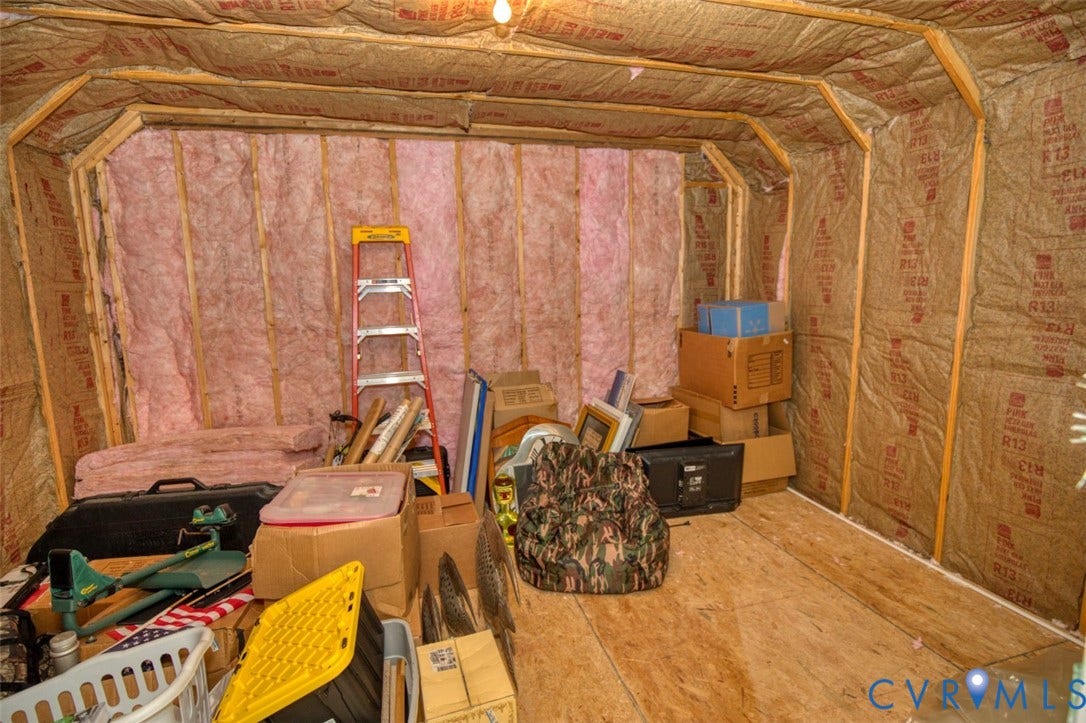 13501 Cooks Mill Court, Cooks Mill, Lanexa, VA 23089 Unfinished interior space featuring exposed wood stud framing, fiberglass batt insulation, and plywood flooring