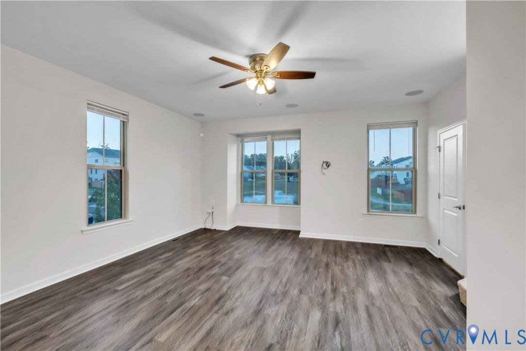 4511 Wistar Woods Trail, Richmond, VA 23228 Living space featuring wood-finish flooring, recessed lighting, multi-pane windows, and a central ceiling fan with integrated lighting