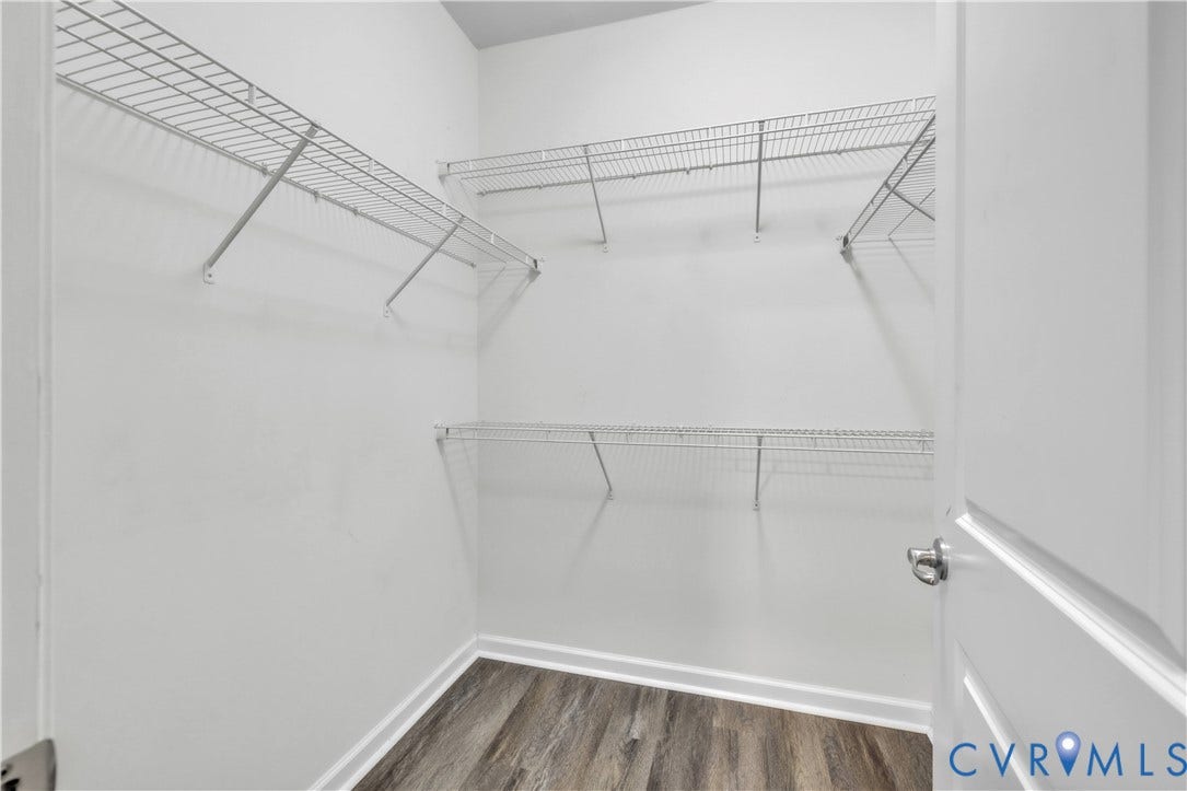 4511 Wistar Woods Trail, Richmond, VA 23228 Storage area featuring multi-level wire shelving and wood-finish flooring