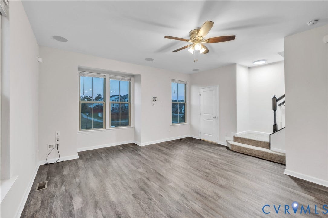 4511 Wistar Woods Trail, Richmond, VA 23228 Interior area featuring wood-finish flooring, recessed lighting, a multi-blade ceiling fan with integrated light fixture, windows with multi-pane glass, and carpeted stairs with a decorative spindle railing