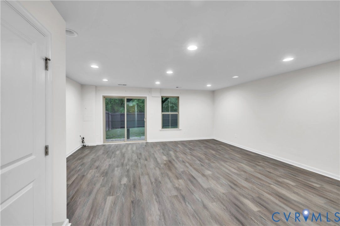 4511 Wistar Woods Trail, Richmond, VA 23228 Interior space featuring wood-finish flooring, recessed lighting, a sliding glass door, and a single-pane window