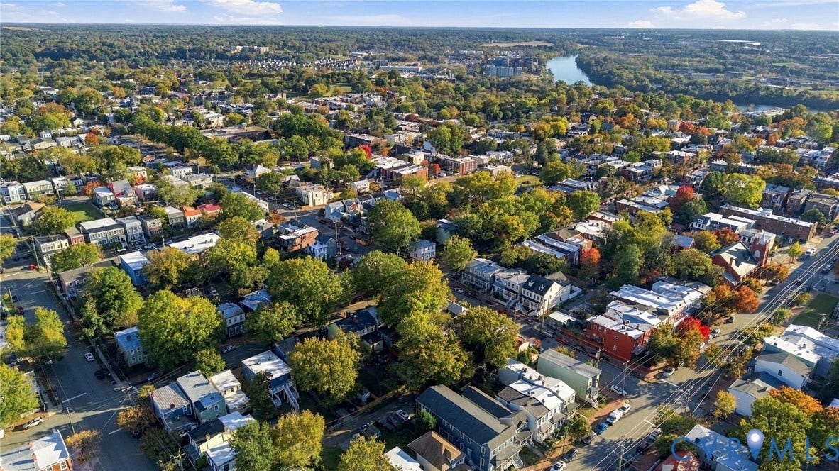 522 N 27th Street, Church Hill, Richmond, VA 23223 Aerial perspective of the neighborhood featuring established mature trees, high-density residential structures, and proximity to a river