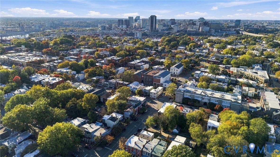 522 N 27th Street, Church Hill, Richmond, VA 23223 Aerial perspective featuring dense tree canopies, residential street grids, and a prominent urban skyline