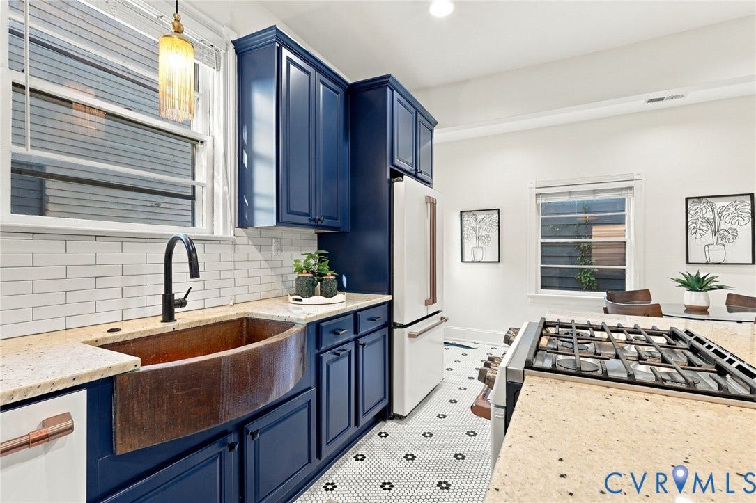 522 N 27th Street, Church Hill, Richmond, VA 23223 Kitchen featuring deep blue shaker-style cabinetry, copper farmhouse sink, stone-composite countertops, subway tile backsplash, and hexagonal mosaic floor tiling
