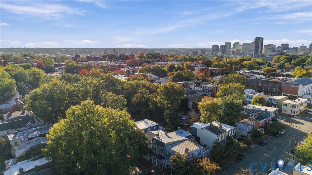 522 N 27th Street, Church Hill, Richmond, VA 23223 Aerial perspective of the neighborhood featuring established mature trees and a prominent urban skyline