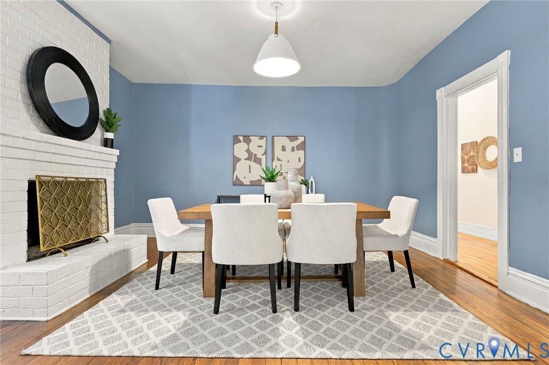 522 N 27th Street, Church Hill, Richmond, VA 23223 White painted brick fireplace, wood-finish flooring, and pendant lighting with view of the corner curved wall.