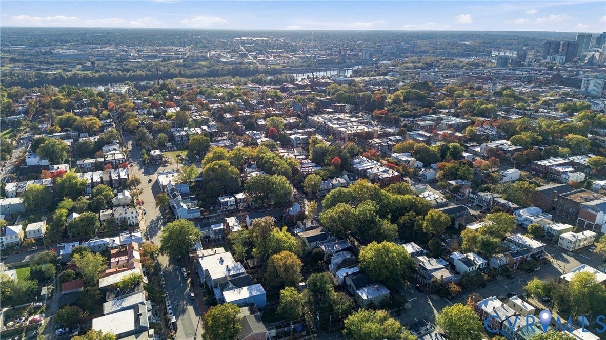 522 N 27th Street, Church Hill, Richmond, VA 23223 Aerial perspective of a dense urban neighborhood featuring established tree canopy, grid-patterned streets, and proximity to a central business district skyline
