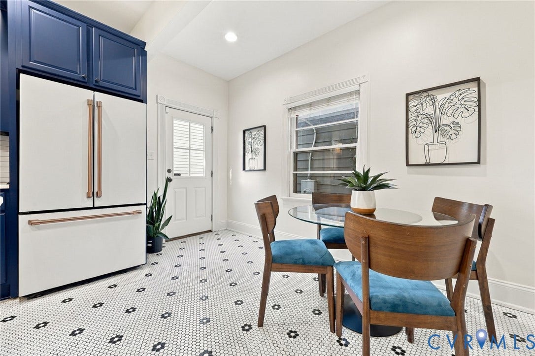 522 N 27th Street, Church Hill, Richmond, VA 23223 Kitchen featuring custom deep blue cabinetry, a white refrigerator with copper-tone hardware, and geometric patterned tile flooring