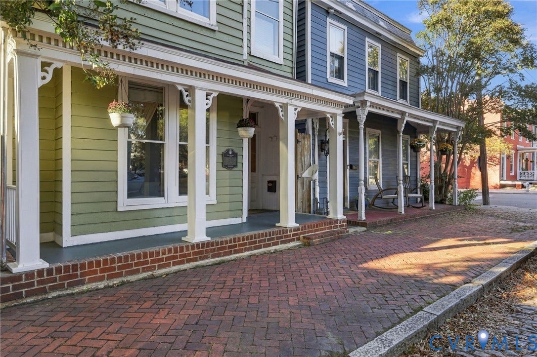 522 N 27th Street, Church Hill, Richmond, VA 23223 Historic exterior featuring multi-colored horizontal lap siding, covered wrap-around porch, ornamental wood brackets, and brick paved walkway