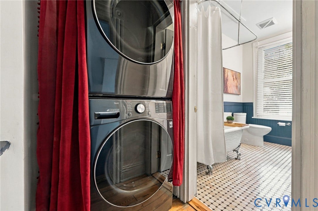 522 N 27th Street, Church Hill, Richmond, VA 23223 Stackable laundry unit with stainless steel finish, clawfoot tub, dual-tone beadboard wainscoting, geometric tile flooring, and window with shutter blinds
