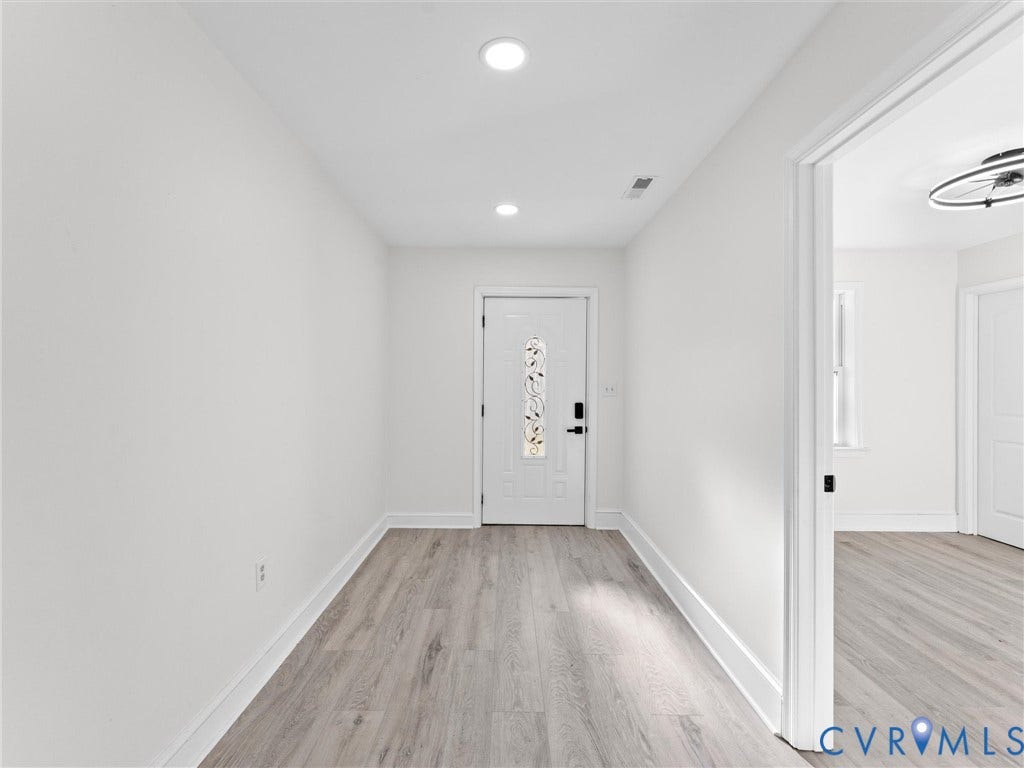 135 Elm Street, Petersburg, VA 23803 Entryway featuring wood-finish flooring, recessed lighting, and a white exterior door with decorative glass insert