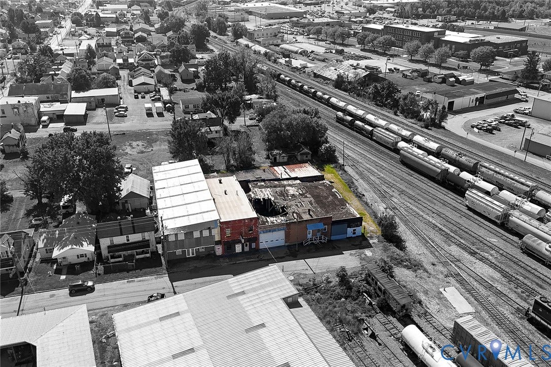 109 E Oak Street, Covington, VA 24426 Aerial perspective of a multi-structure commercial site featuring metal and masonry construction, flat roofing systems, and direct street frontage