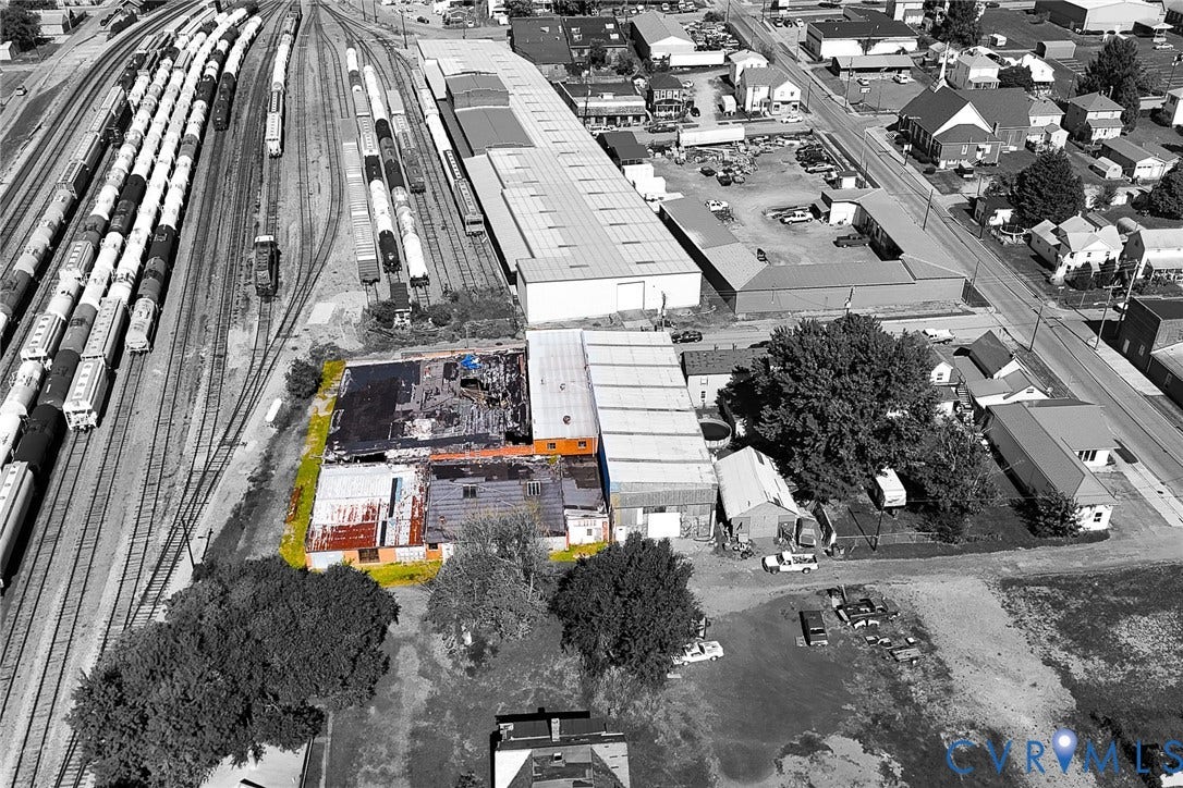 109 E Oak Street, Covington, VA 24426 Industrial property featuring a low-slope roof, masonry exterior walls, and immediate rail line access