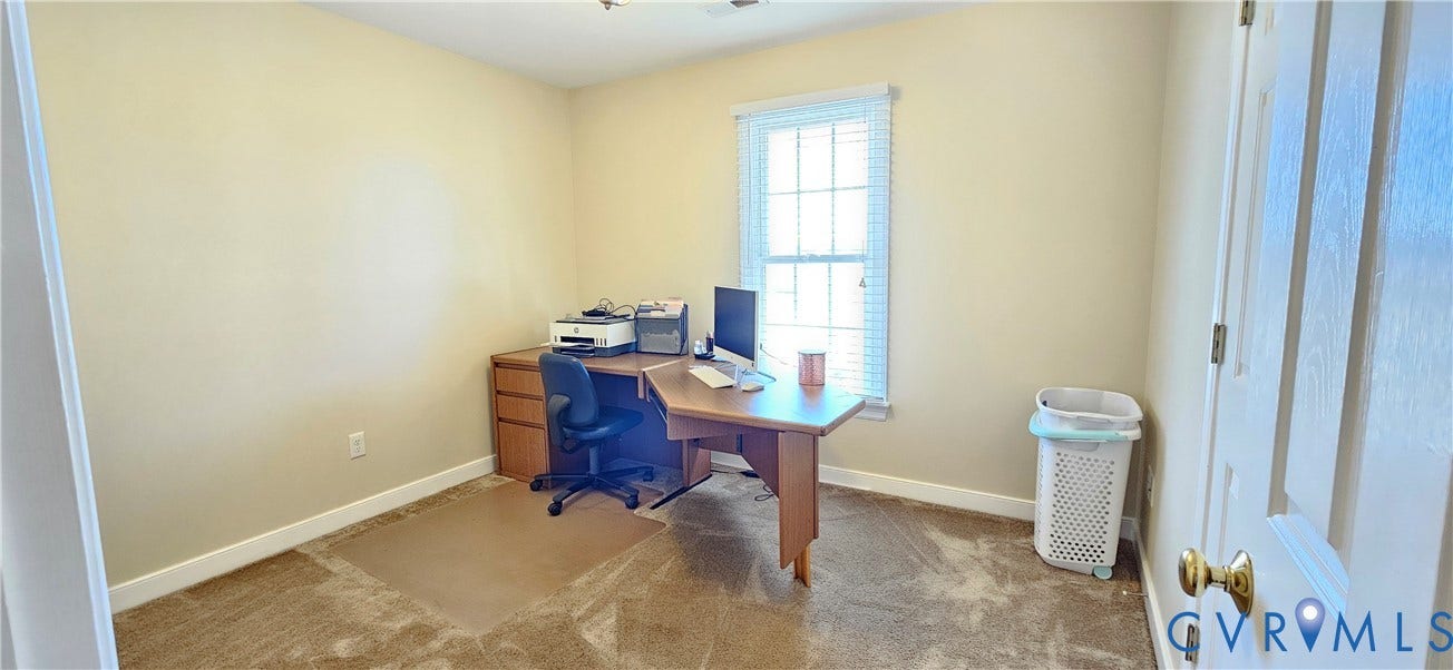 8605 Howerton Road, Center Cross, VA 22437 Neutral-toned room featuring wall-to-wall carpeting and a multi-pane window with blinds