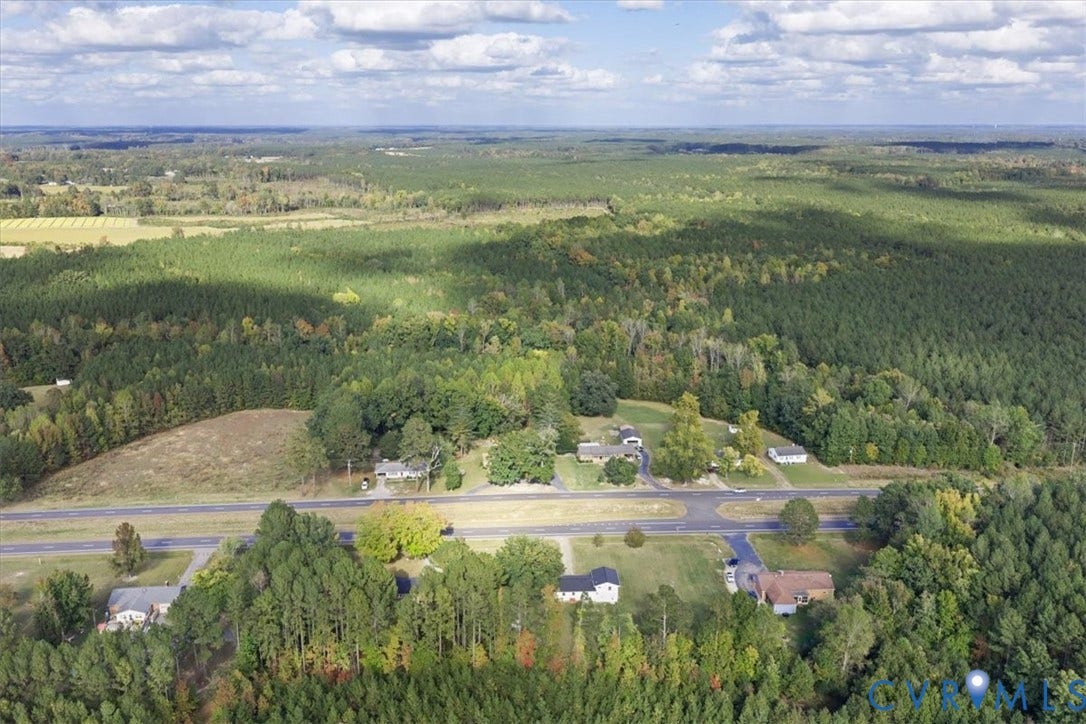 4942 Pleasant Shade Drive, Emporia, Emporia, VA 23847 Aerial perspective featuring expansive acreage, mature tree coverage, and paved road access