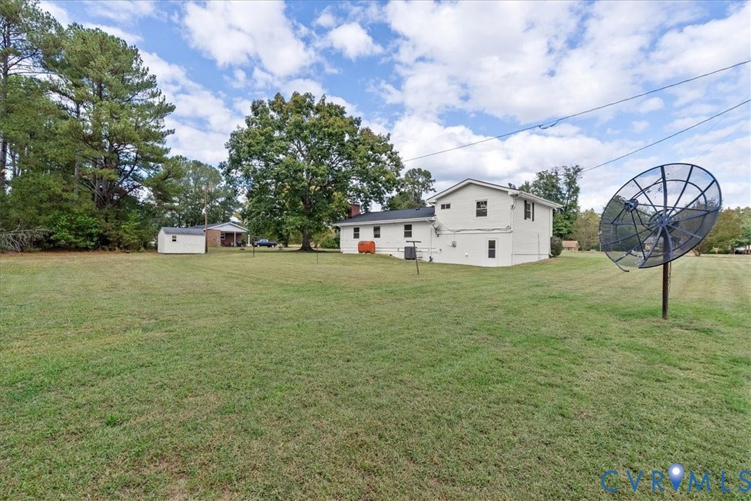 4942 Pleasant Shade Drive, Emporia, Emporia, VA 23847 Expansive yard featuring mature trees and a detached storage structure