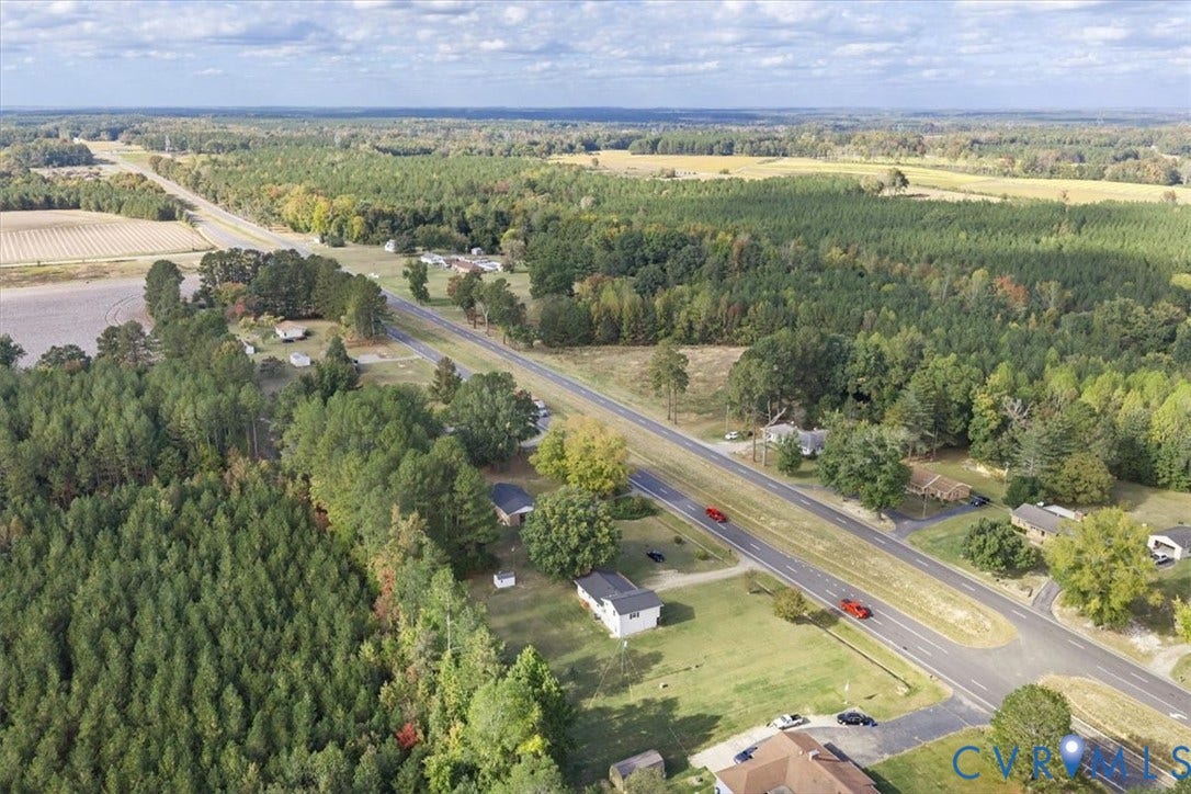 4942 Pleasant Shade Drive, Emporia, Emporia, VA 23847 Aerial perspective featuring expansive acreage, mature tree clusters, and direct road access