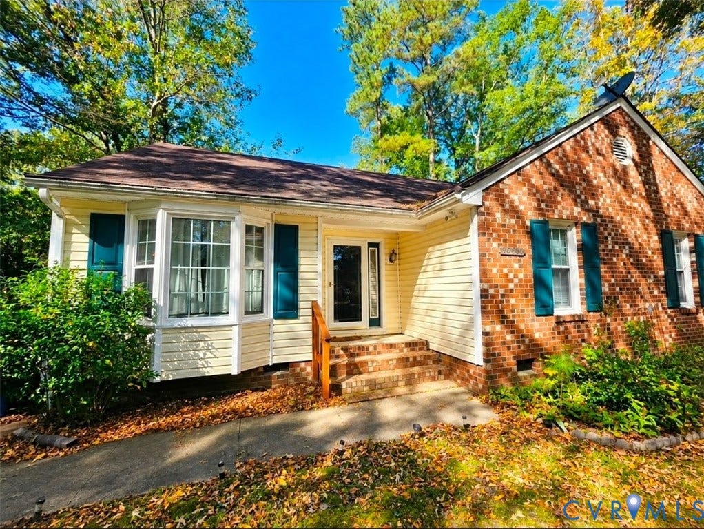 10800 Drayton Road, Chesterfield, VA 23831 Exterior facade featuring a mix of brick and horizontal siding, a bay window, decorative shutters, and a covered entryway with brick steps