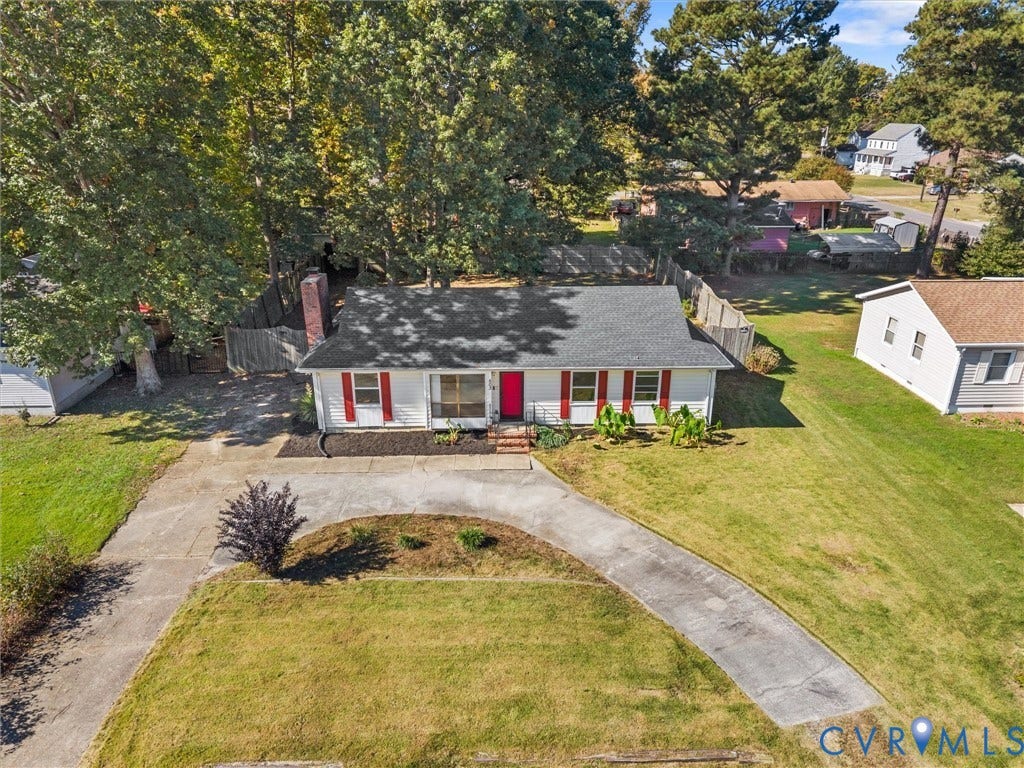 503 Briarwood Circle, Jefferson Circle, North Prince George, VA 23860 Ranch-style residence featuring white siding, red shutters, a brick exterior chimney, asphalt shingle roofing, and a curved concrete driveway