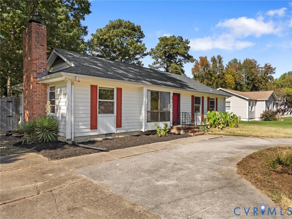 503 Briarwood Circle, Jefferson Circle, North Prince George, VA 23860 Single-story residence featuring horizontal lap siding, red window shutters, an exterior brick chimney, and a concrete driveway