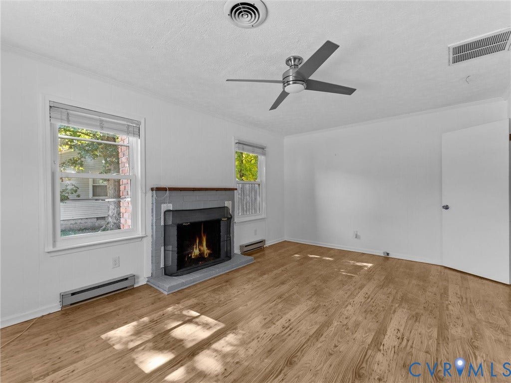 503 Briarwood Circle, Jefferson Circle, North Prince George, VA 23860 Wood-finish flooring, masonry fireplace with a wood mantel, multi-pane windows, and a ceiling fan