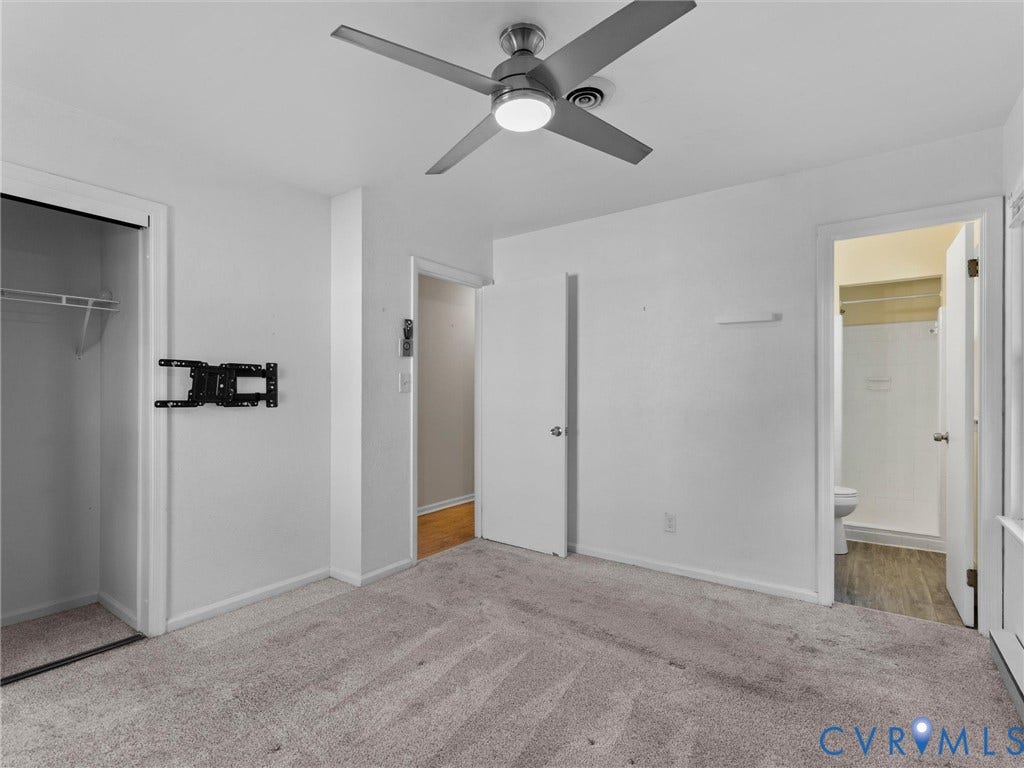 503 Briarwood Circle, Jefferson Circle, North Prince George, VA 23860 Neutral-toned carpeting, ceiling fan with integrated lighting, built-in closet, and doorway access to an interior bath