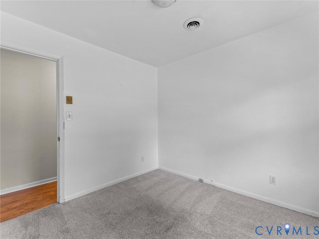 503 Briarwood Circle, Jefferson Circle, North Prince George, VA 23860 Interior room featuring neutral wall paint, wall-to-wall carpeting, and wood-finish flooring visible through the doorway