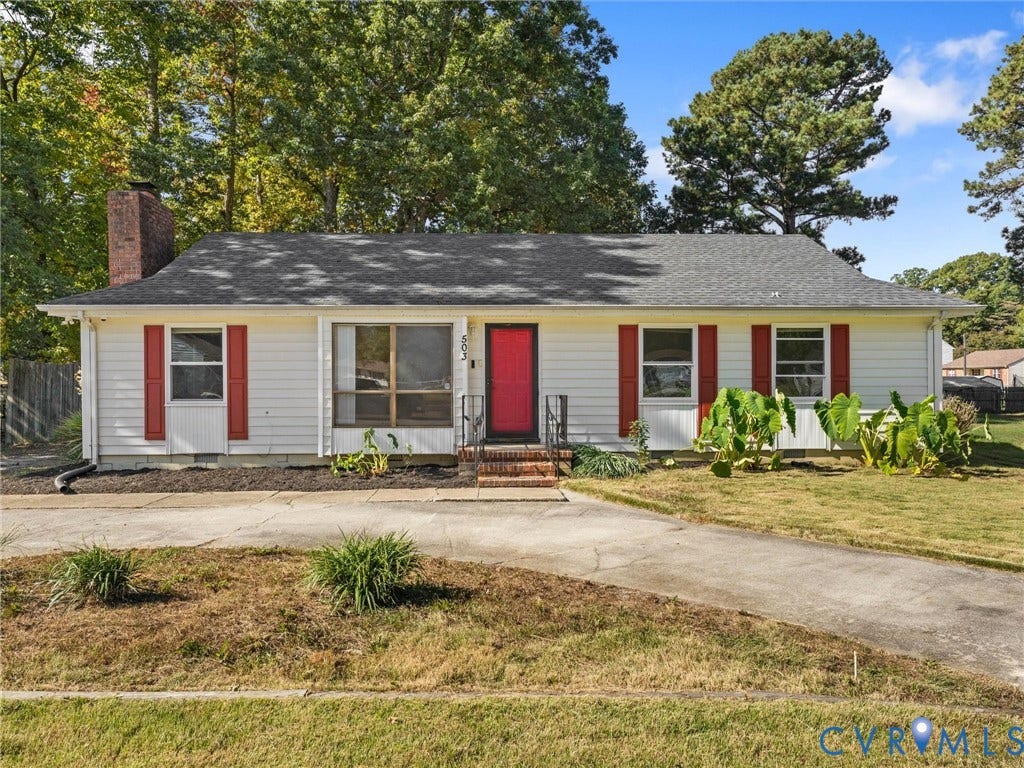 503 Briarwood Circle, Jefferson Circle, North Prince George, VA 23860 Single-story residence featuring light-colored siding, contrasting red shutters, a brick chimney, a concrete driveway, and a shingled roof
