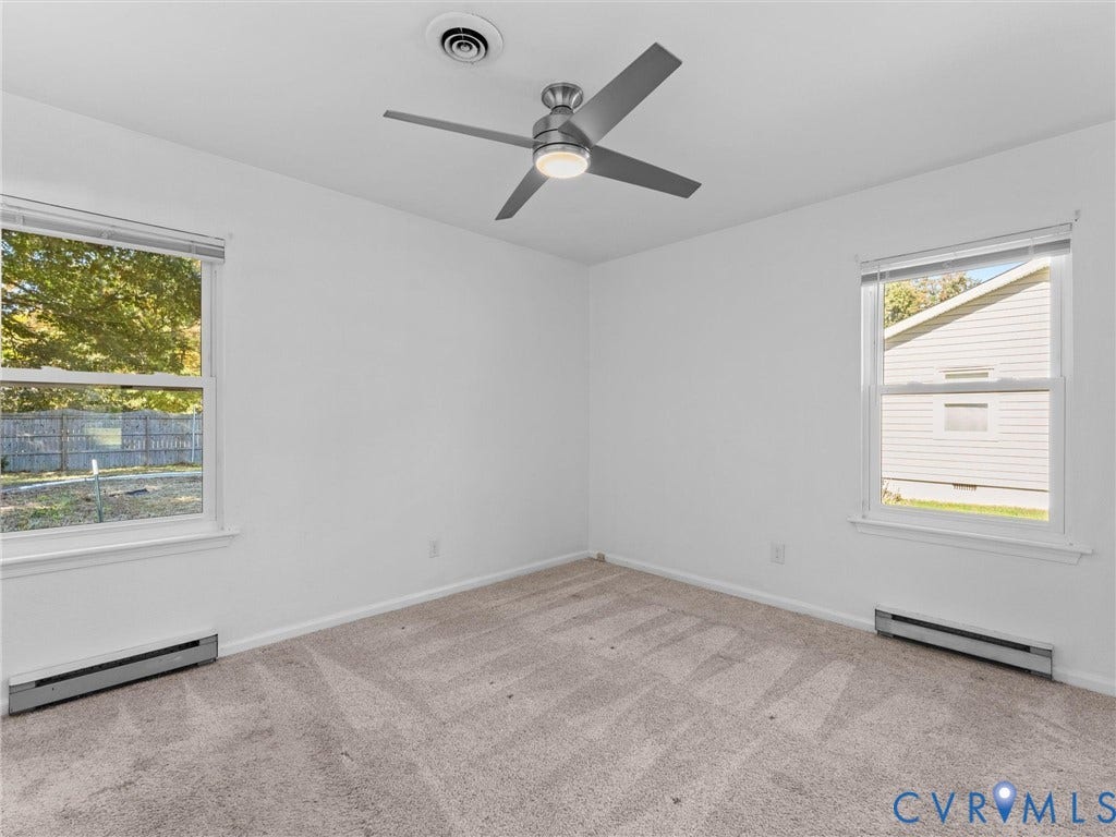 503 Briarwood Circle, Jefferson Circle, North Prince George, VA 23860 Room featuring wall-to-wall carpeting, dual windows, and a brushed metal ceiling fan with integrated lighting