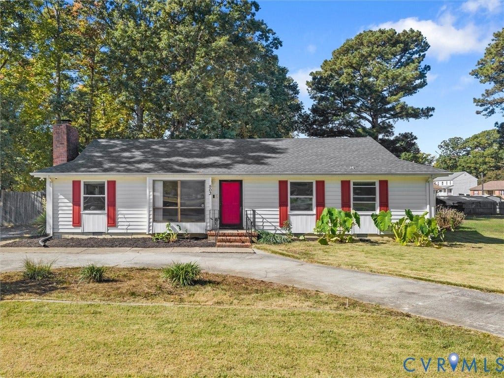 503 Briarwood Circle, Jefferson Circle, North Prince George, VA 23860 Single-story residence featuring light-colored horizontal siding, brick chimney, concrete driveway, and contrasting exterior shutters