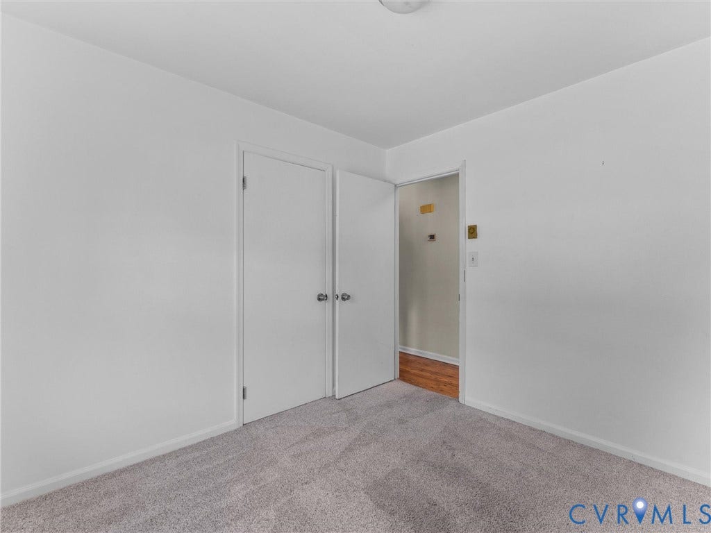 503 Briarwood Circle, Jefferson Circle, North Prince George, VA 23860 Neutral-toned carpet flooring, smooth interior walls, and dual hinged closet doors with metallic hardware