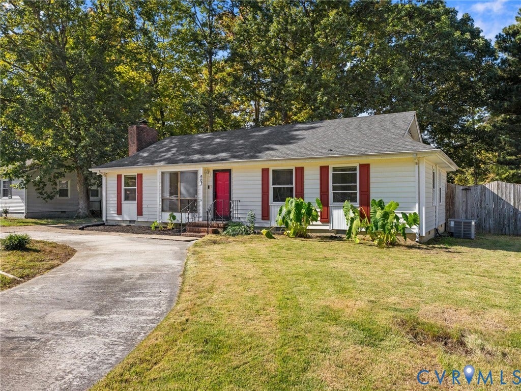 503 Briarwood Circle, Jefferson Circle, North Prince George, VA 23860 Single-story exterior featuring white horizontal siding, red shutters, a brick chimney, and a concrete driveway