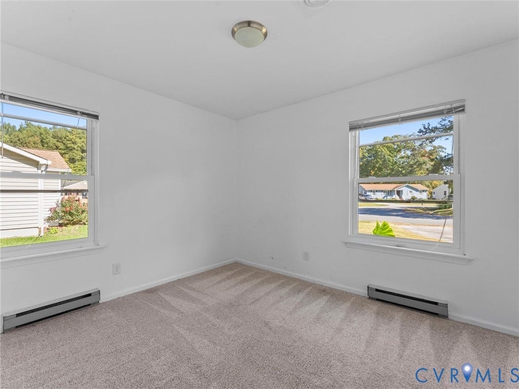 503 Briarwood Circle, Jefferson Circle, North Prince George, VA 23860 Neutral interior room featuring wall-to-wall carpeting, two double-hung windows, and a flush-mount ceiling light fixture