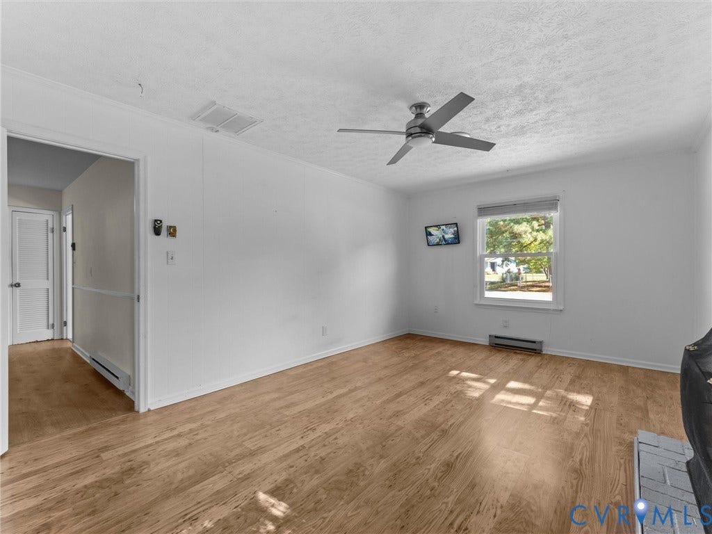 503 Briarwood Circle, Jefferson Circle, North Prince George, VA 23860 Interior space featuring wood-finish flooring, a ceiling fan, and a single-pane window