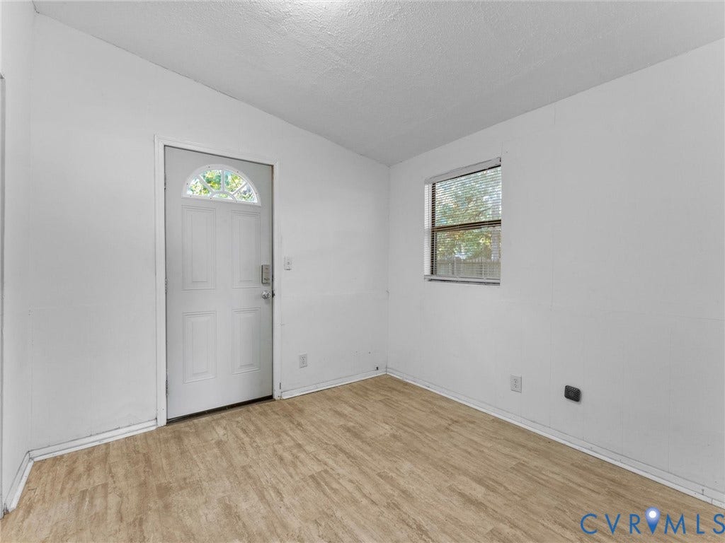 503 Briarwood Circle, Jefferson Circle, North Prince George, VA 23860 Wood-finish flooring, white walls, and a single-hung window with mini-blinds