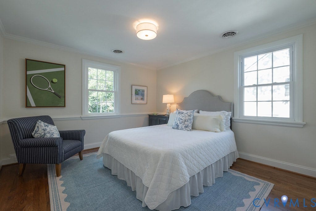 Hardwood flooring, dual multi-pane windows, and crown molding