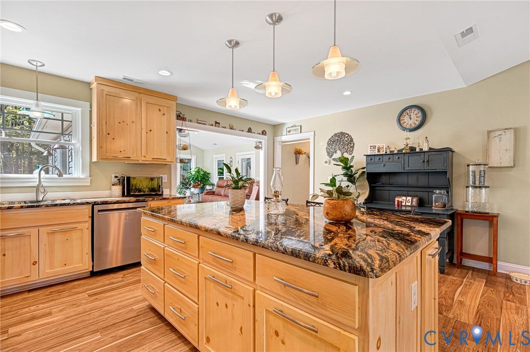 3820 Upshaw Road, Decker's Pond, Aylett, VA 23009 Kitchen featuring a center island with a stone countertop, light wood cabinetry, stainless steel dishwasher, and wood-finish flooring