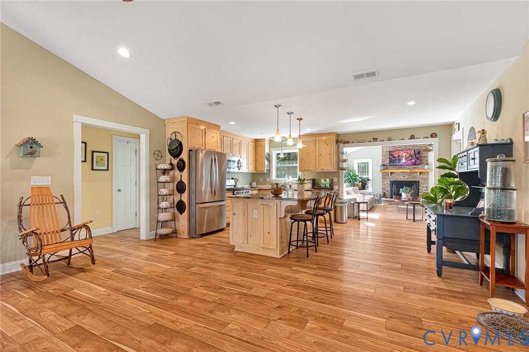 3820 Upshaw Road, Decker's Pond, Aylett, VA 23009 Open-concept kitchen featuring natural wood cabinetry, a central island with a countertop, stainless steel appliances, recessed lighting, and wood-finish flooring