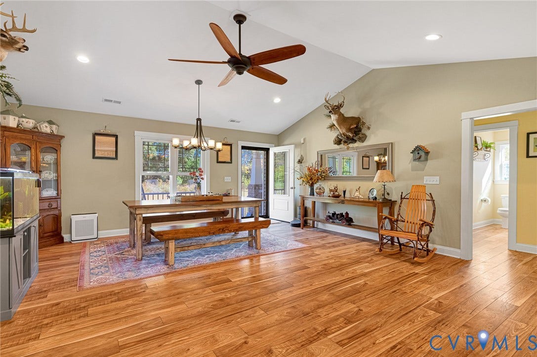 3820 Upshaw Road, Decker's Pond, Aylett, VA 23009 Vaulted ceilings, wood-finish flooring, recessed lighting, and a multi-arm chandelier