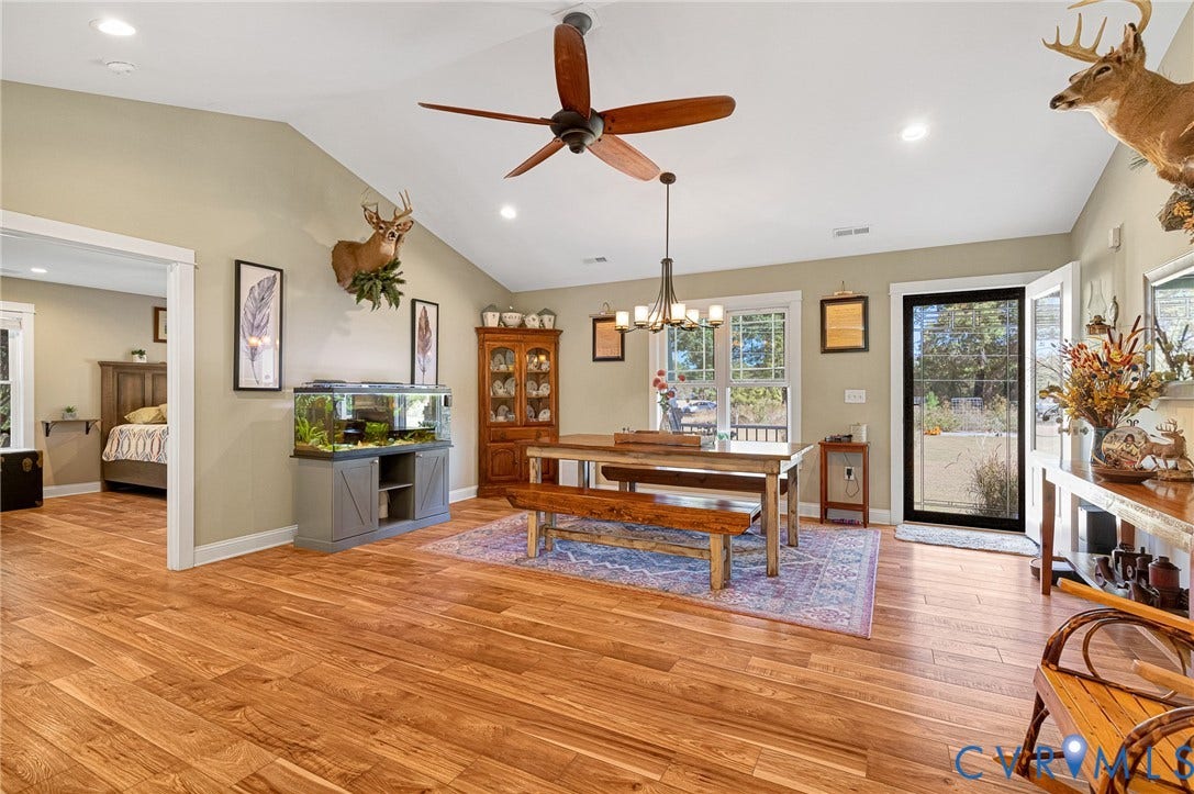 3820 Upshaw Road, Decker's Pond, Aylett, VA 23009 Vaulted ceilings, wood-finish flooring, recessed lighting, multi-arm chandelier, and glass-paned exterior door